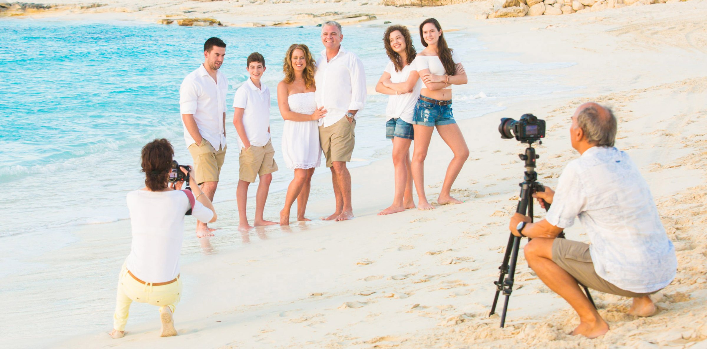 A family portrait session in action on the beach