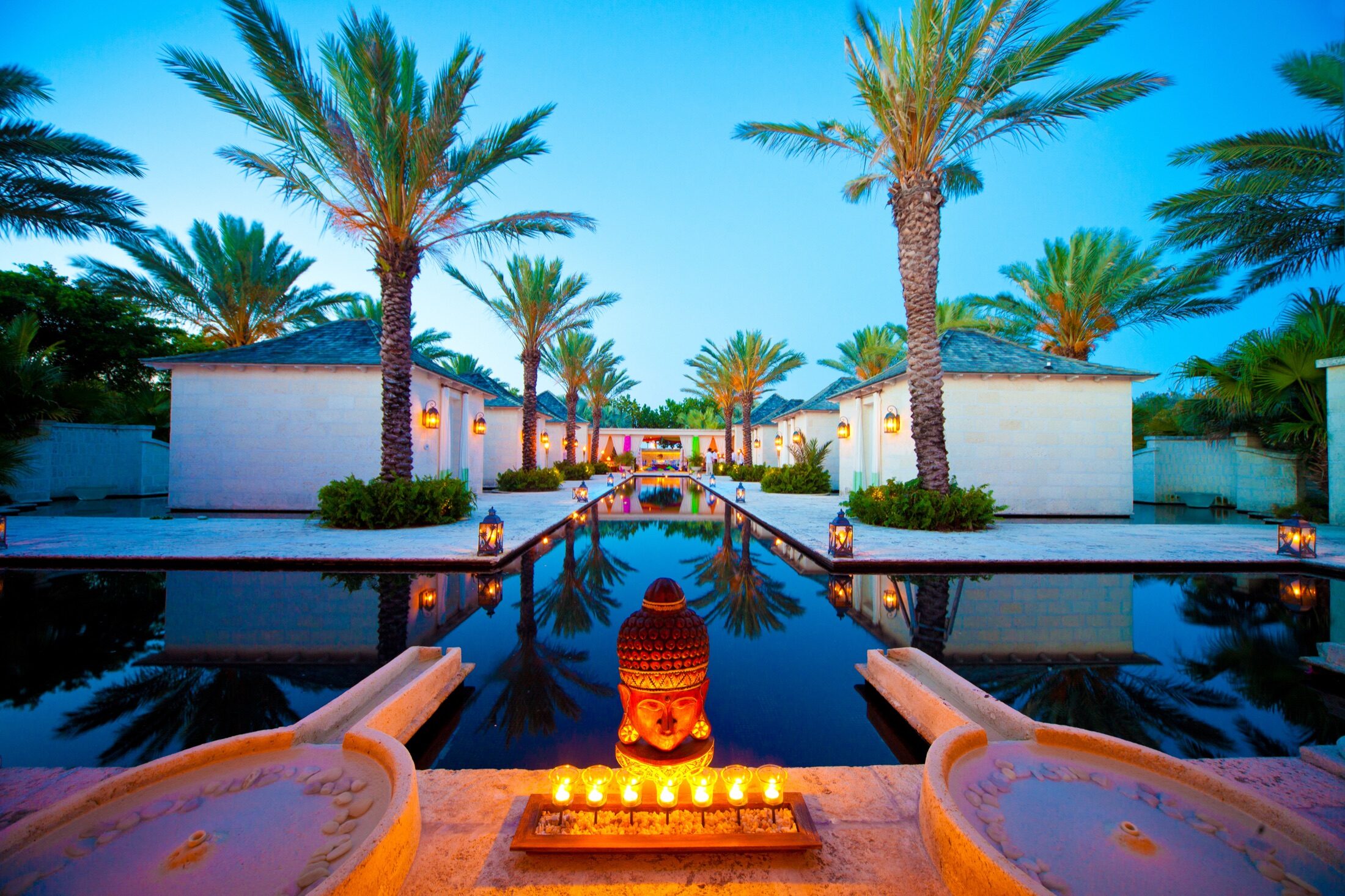 Palm-lined reflecting pool at a Turks and Caicos resort