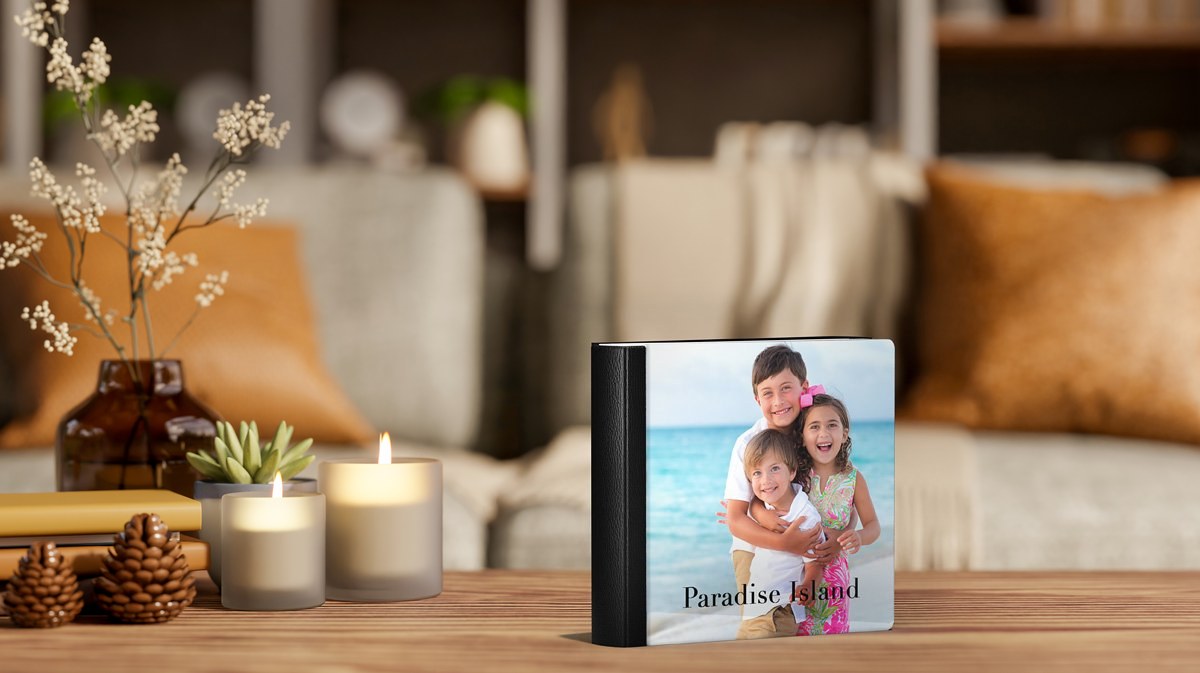 Printed photo album on a coffee table in a living room